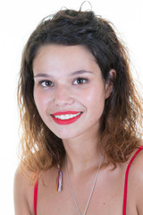 Happy Beautiful brunette woman in red t-shirt isolated on white wall background