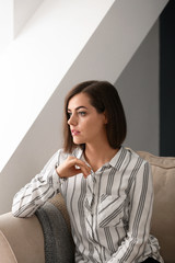 Naklejka premium Portrait of beautiful young woman at home