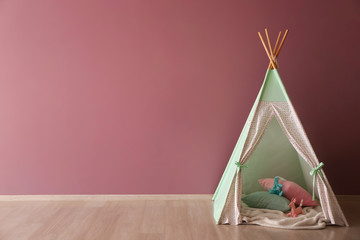 Fototapeta na wymiar Cozy play tent for kids in child room