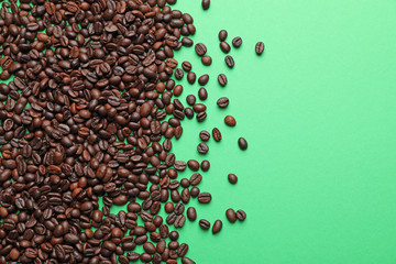 Coffee beans on color background