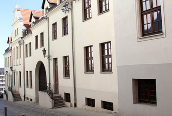 Fototapeta na wymiar Buildings of Szczecin old town, west Poland. Architecture of narrow streed in castle neighbourhood.