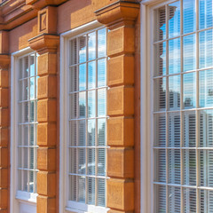 Reflective glass windows of a brown building