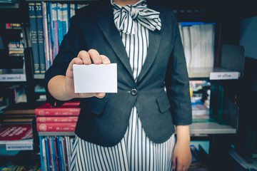 Girl holding a white business card. For business contact
