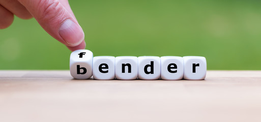 Hand is turning dice and changes the word fender to bender