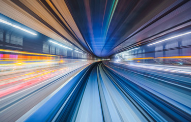 Motion blur of train moving inside tunnel in Tokyo, Japan - obrazy, fototapety, plakaty