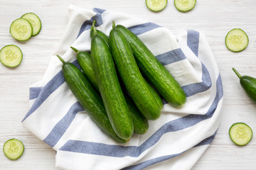 Fresh raw green cucumbers, overhead view. Flat lay, from above, top view.