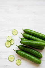 Fresh raw green cucumbers, top view. Flat lay, from above, overhead. Copy space.