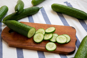 Raw organic green cucumbers, side view. Closeup.