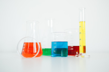 Laboratory equipment. Laboratory glassware on white table