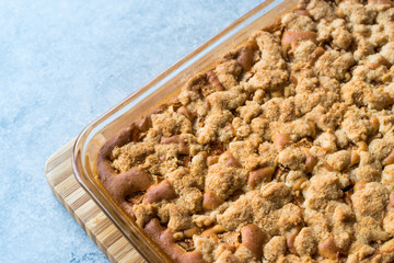 Homemade Whole Crumble Cake in Glass Bowl. Freshly Baked.