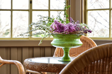 Scene of the decoration of the flower on the table near the window of the house