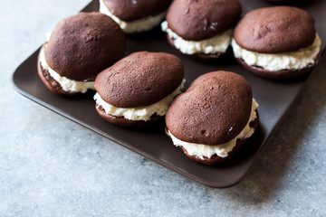 Homemade Chocolate Pies Filled with Vanilla Butter Cream.