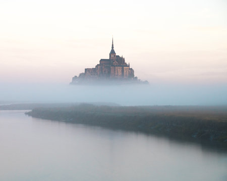 Mount Saint Michel, Normandy, France, during a foggy sunrise