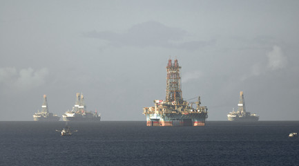 Offshore oil rig and drilling vessels in Chaguaramas Bay, Trinidad and Tobago working on oil...