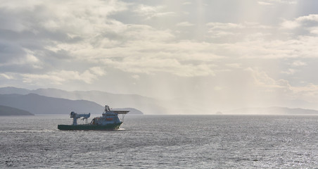 Offshore supply and diving support vessel working on a oil industry project  at sea.