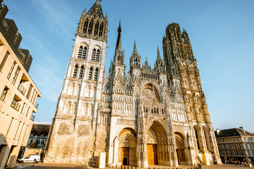 View from below on the facade of the famous Rouen gothic cathedral in Rouen city, the capital of Normandy region in France - obrazy, fototapety, plakaty
