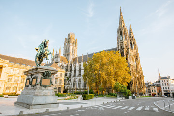 Street view with Napoleon monument and church of saint-Ouen during the sunset in Rouen city, France - obrazy, fototapety, plakaty