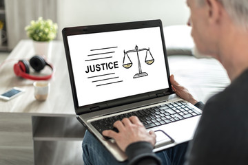 Fototapeta na wymiar Justice concept on a laptop screen