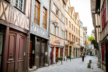 Fototapeta na wymiar Ancient half-timbered houses on the street of the old town in Rouen city, the capital of Normandy region in France