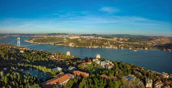 Wide panoramic aerial view of Fatih Sultan Mehmet Bridge and Rumeli Castle and Bosphorus University Campus