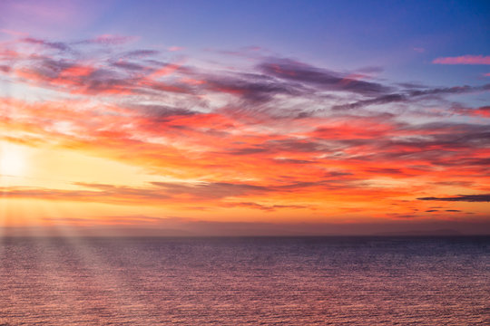 Dramatic Sunrise with Sun Rays over the Sea