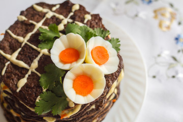 liver cake beautifully decorated with eggs and carrots