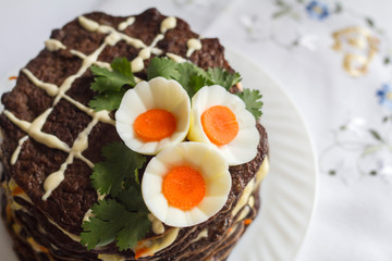 liver cake beautifully decorated with eggs and carrots
