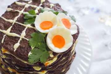 liver cake beautifully decorated with eggs and carrots
