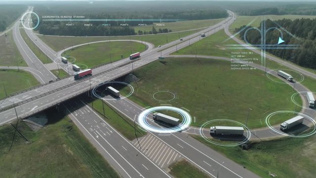 Convoy of trucks ride on the highway, technologies, artificial intelligence tracks trucks, motion graphics element from height.