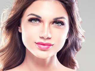 Beautiful eyes lips woman face closeup with healthy skin and beauty maakeup