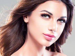 Beautiful eyes lips woman face closeup with healthy skin and beauty maakeup