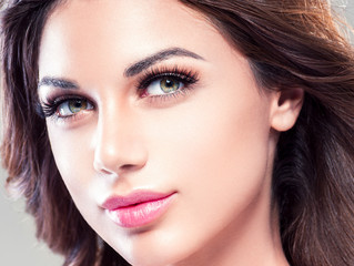 Beautiful eyes lips woman face closeup with healthy skin and beauty maakeup