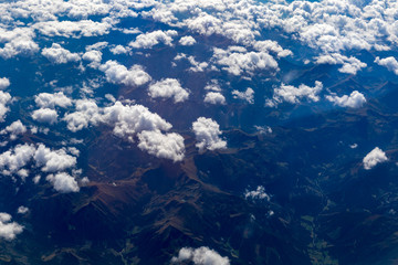 Naklejka na ściany i meble Landscape with clouds seen from the plane
