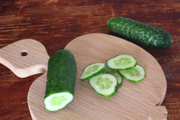 Cucumbers on wooden background