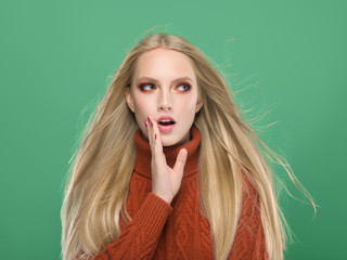 Woman in knitted sweater fashion with blonde long hair autumn stylish