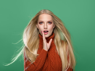 Woman in knitted sweater fashion with blonde long hair autumn stylish