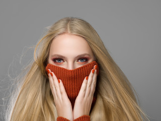 Woman in knitted sweater fashion with blonde long hair autumn stylish