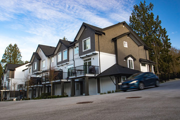 Great and comfortable neighborhood. A row of townhouses at the empty street.