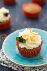 Homemade cupcake with orange and mint
