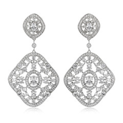 Pair of silver diamond earrings isolated on white