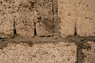 dark orange beige brick with cement close-up