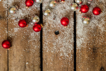 Christmas background with snow and small christmas balls