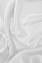 Fototapeta premium Smooth elegant white silk or satin luxury cloth texture as wedding background. Luxurious background design
