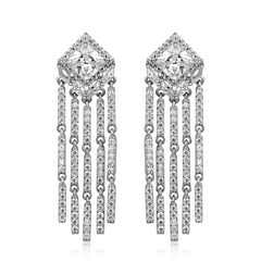 Pair of silver diamond earrings isolated on white