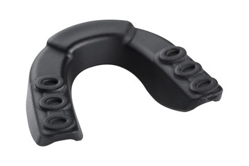 black rubber protection for teeth, for boxing or for karate, back side, on a white background, isolate