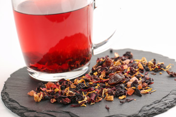 Still life, aromatic dry tea with fruits and petals