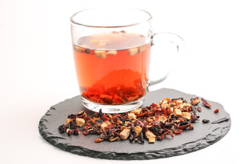 Still life, aromatic dry tea with fruits and petals