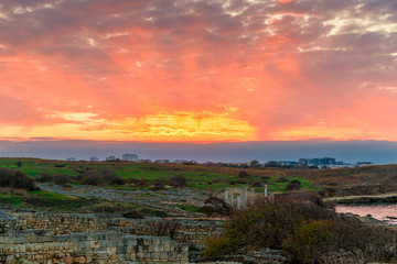 Obraz premium Sunset, beautiful orange sky over Ancient Chersonesos in Crimea, Russia