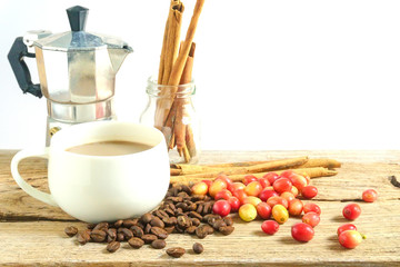 cup of coffee with cinnamon and anise stars on a dark wooden background
