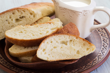 Homemade bread on a ceramic dish. Bread for traditional breakfast. Close-up.